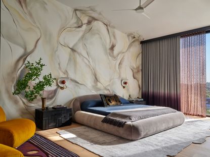 A bedroom with smokescape mural